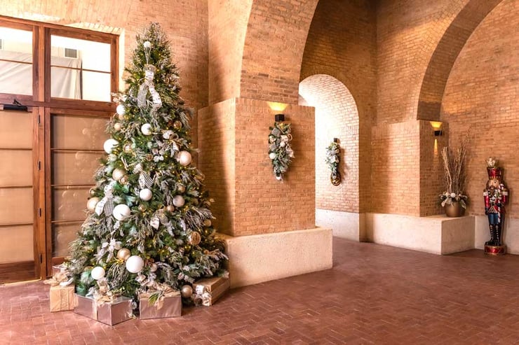 Christmas tree and decorations in a face brick building done by Natura 