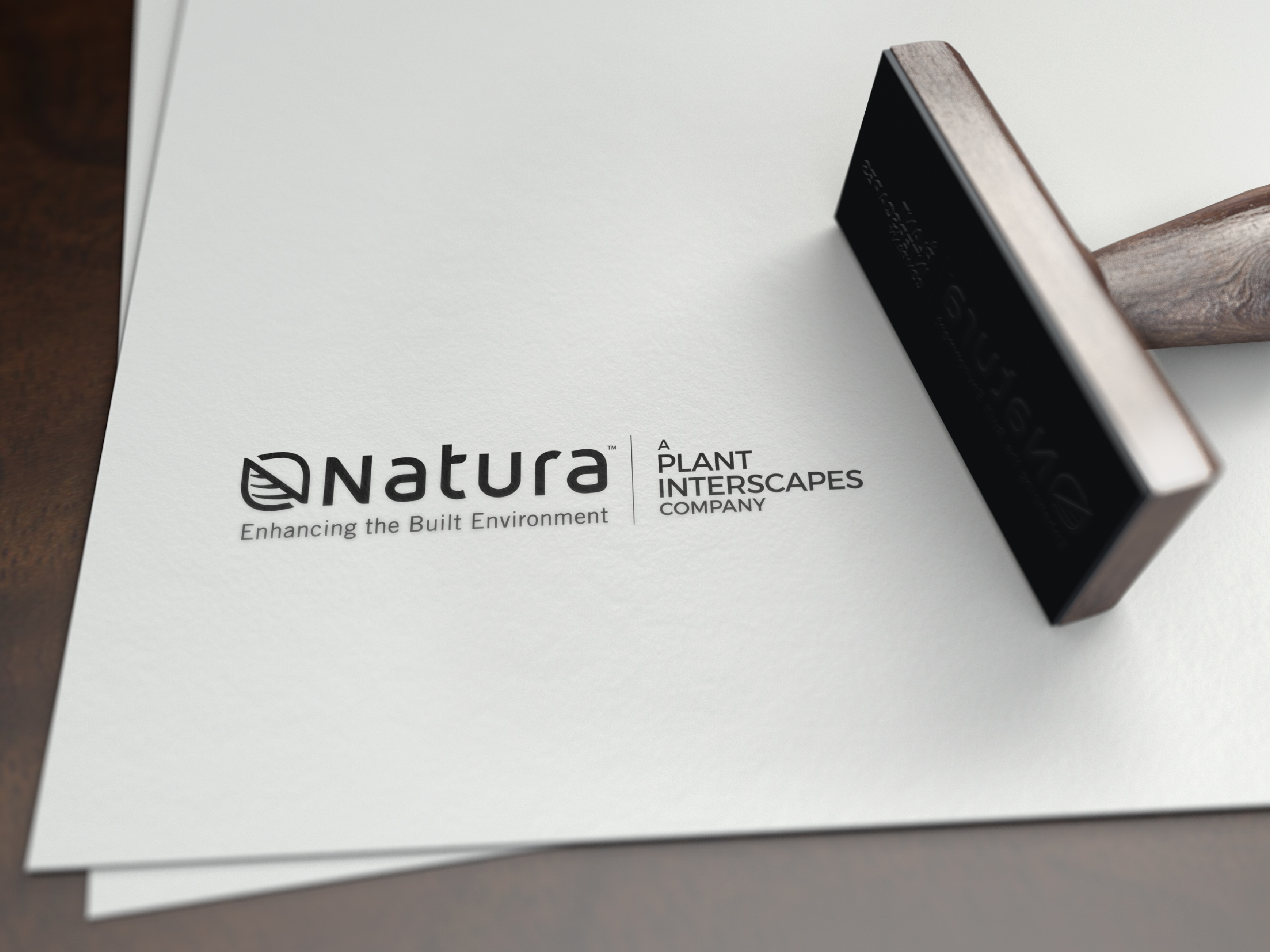 image of the natura logo with a stamp on the side